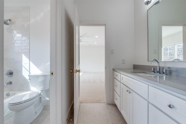 full bathroom featuring vanity, bathing tub / shower combination, and toilet