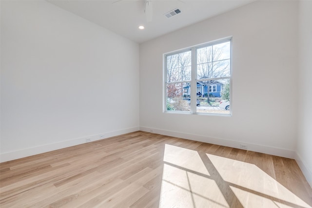 unfurnished room featuring ceiling fan and light wood-type flooring