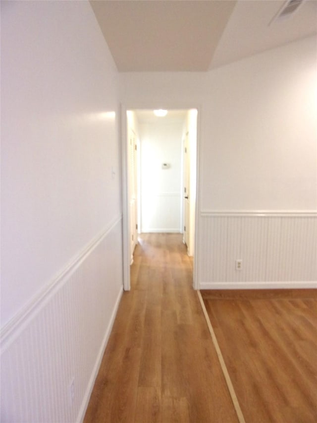 hallway featuring wood-type flooring