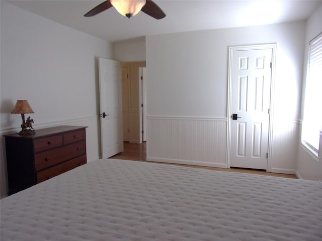 bedroom featuring ceiling fan and light hardwood / wood-style floors