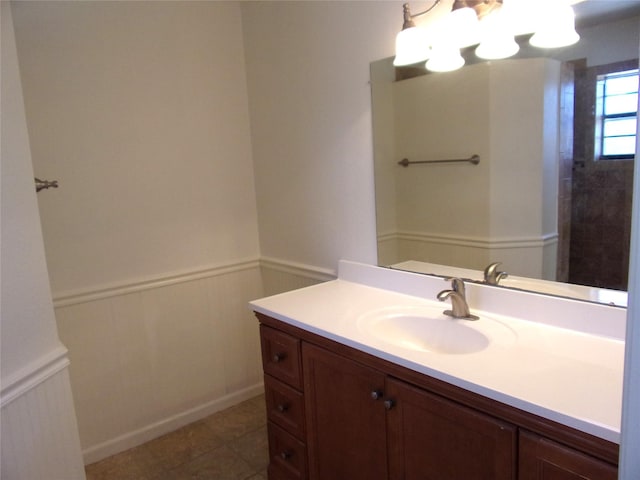 bathroom featuring tile patterned flooring and vanity