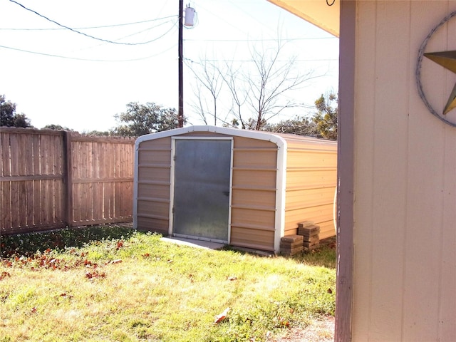 view of outdoor structure with a lawn