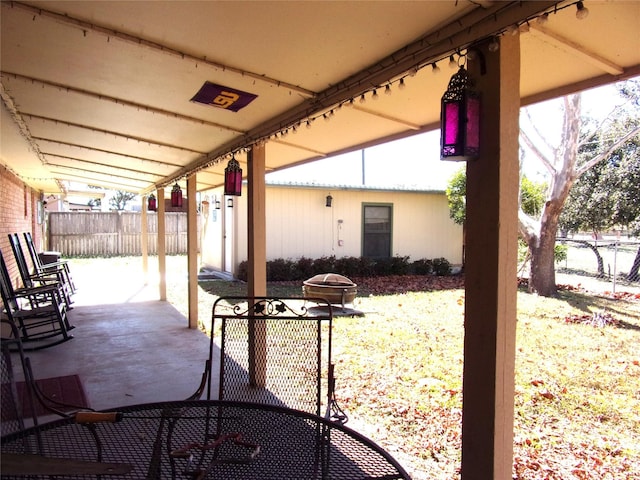 view of patio with a fire pit