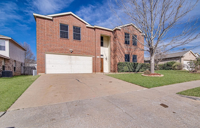 view of front of home with a garage, a front yard, and central AC unit