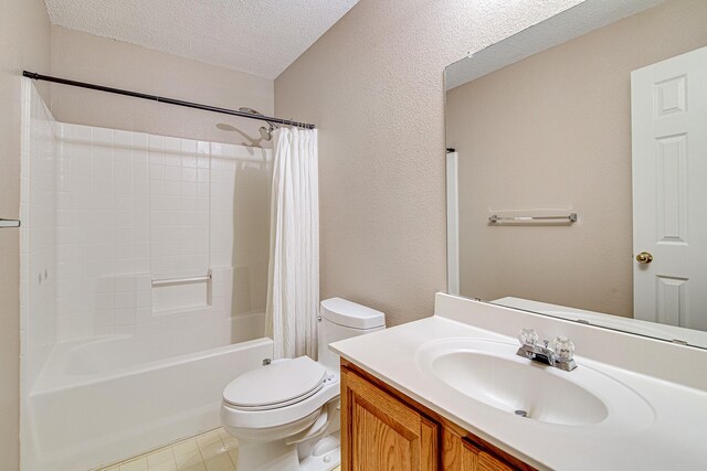 full bathroom with shower / tub combo with curtain, toilet, a textured ceiling, vanity, and a textured wall