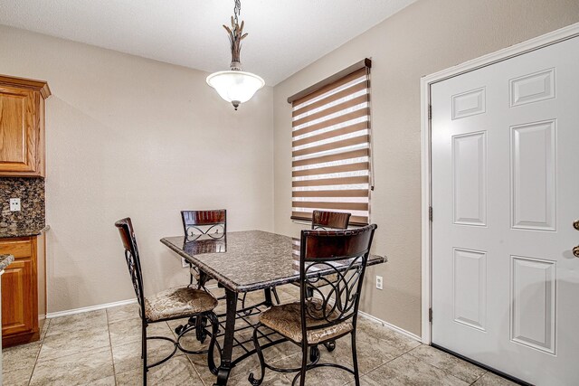 dining space with baseboards