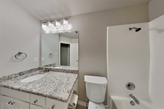 full bathroom featuring toilet, vanity, and bathtub / shower combination