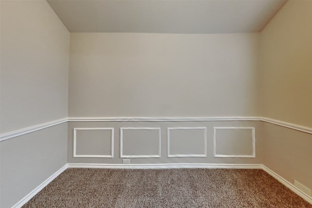 unfurnished room featuring vaulted ceiling and carpet