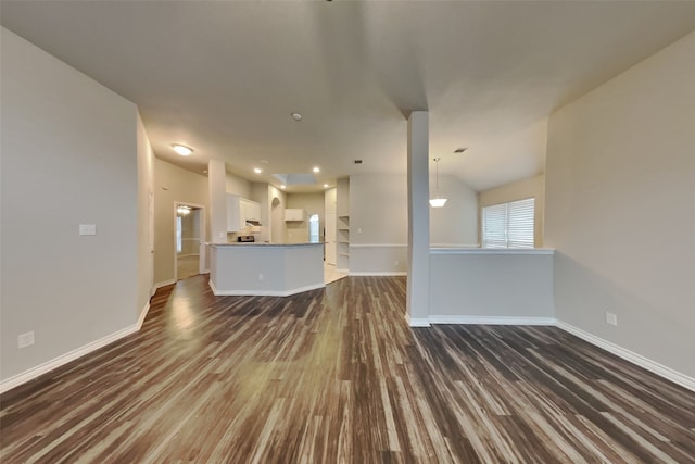 unfurnished living room with dark hardwood / wood-style floors