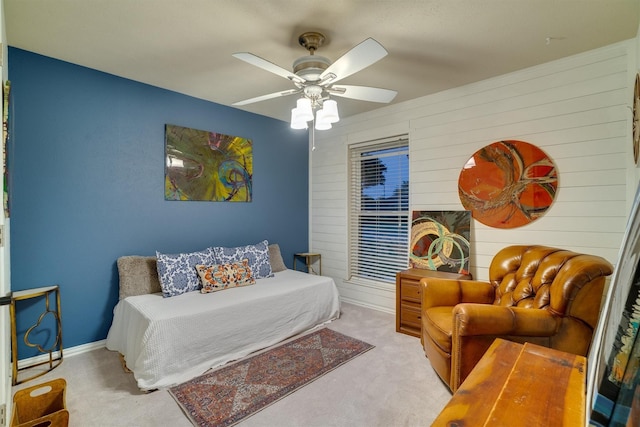 bedroom with light carpet and ceiling fan