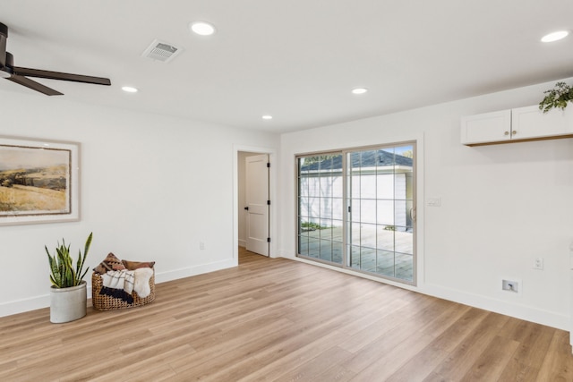 spare room featuring ceiling fan and light hardwood / wood-style flooring