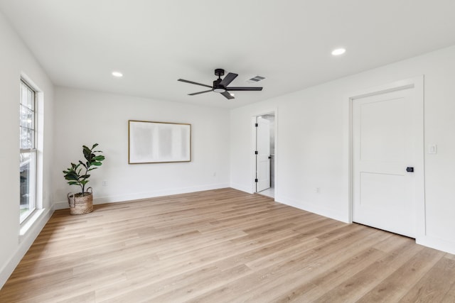 spare room with ceiling fan and light hardwood / wood-style floors