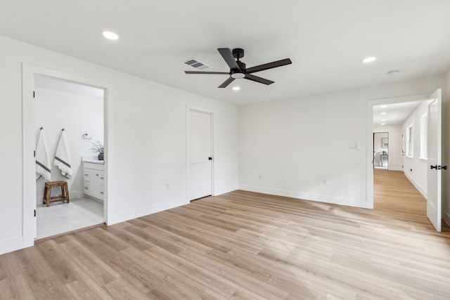 spare room with light hardwood / wood-style flooring and ceiling fan