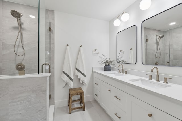 bathroom featuring vanity, tile patterned floors, and walk in shower