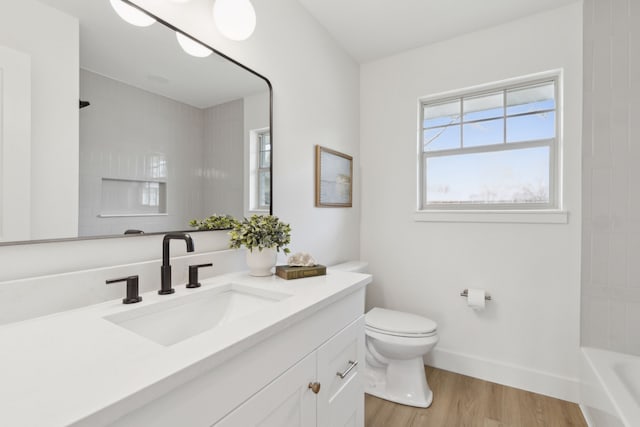 bathroom featuring vanity, hardwood / wood-style floors, and toilet