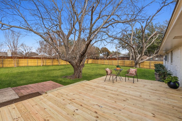 wooden terrace with a yard