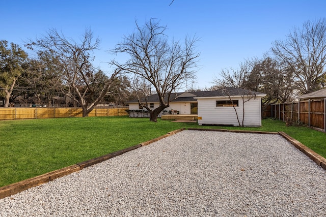 back of house with a lawn, a patio, and a deck