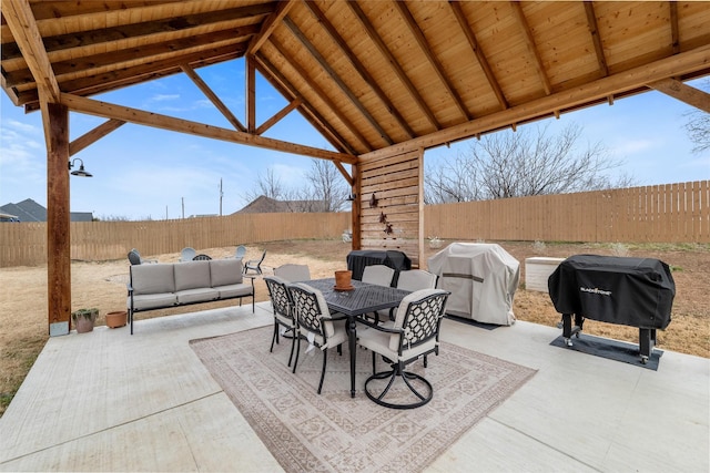 view of patio with a grill, a gazebo, and an outdoor living space