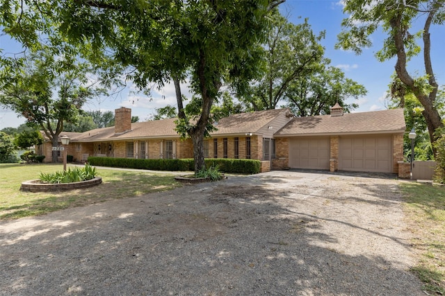 single story home with a garage