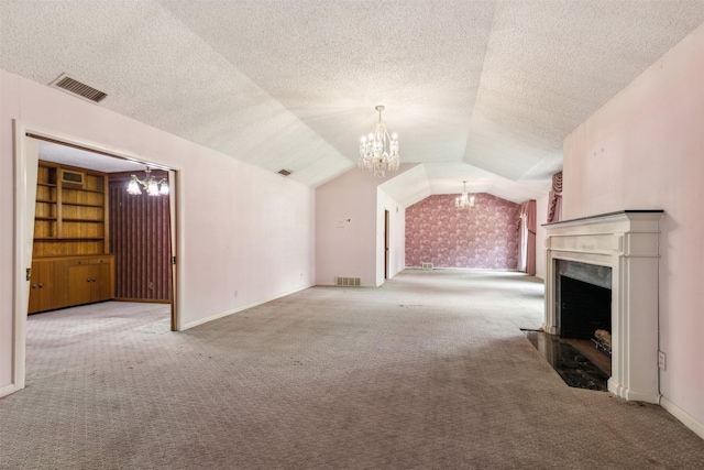 unfurnished living room with a notable chandelier, vaulted ceiling, light colored carpet, and a textured ceiling