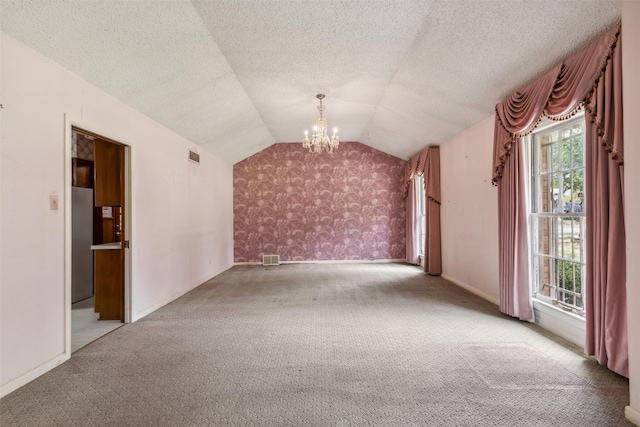 bonus room with lofted ceiling, a textured ceiling, light carpet, and a chandelier