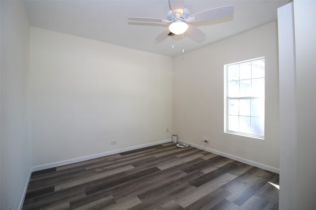 231 N 5th Ave, Munday, TX 76371 - spare room with ceiling fan and dark hardwood / wood-style flooring