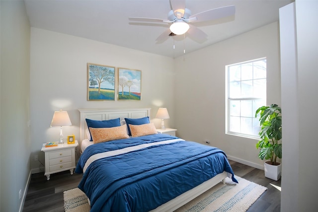 231 N 5th Ave, Munday, TX 76371 - bedroom featuring dark hardwood / wood-style floors and ceiling fan