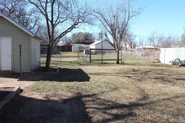 231 N 5th Ave, Munday, TX 76371 - view of yard with a storage unit