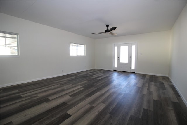 231 N 5th Ave, Munday, TX 76371 - empty room with ceiling fan and dark hardwood / wood-style floors