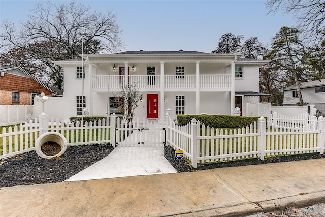 view of front of home with a balcony and covered porch