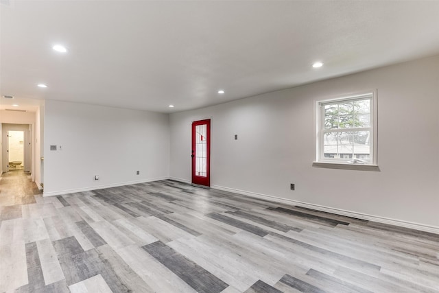 unfurnished room with light hardwood / wood-style floors