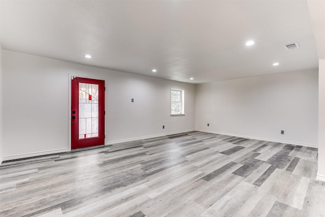 spare room featuring light hardwood / wood-style flooring