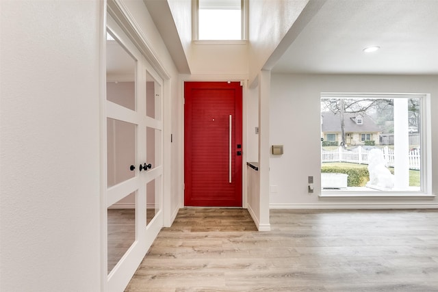 entryway with plenty of natural light and light wood-type flooring