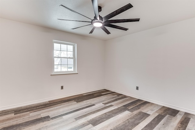 empty room with wood-type flooring and ceiling fan