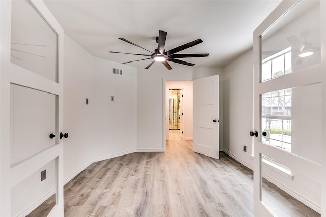 unfurnished room featuring ceiling fan and light hardwood / wood-style floors