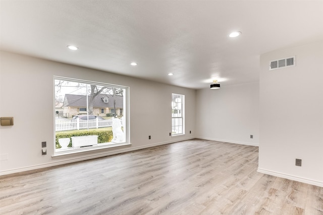 unfurnished living room with light hardwood / wood-style flooring