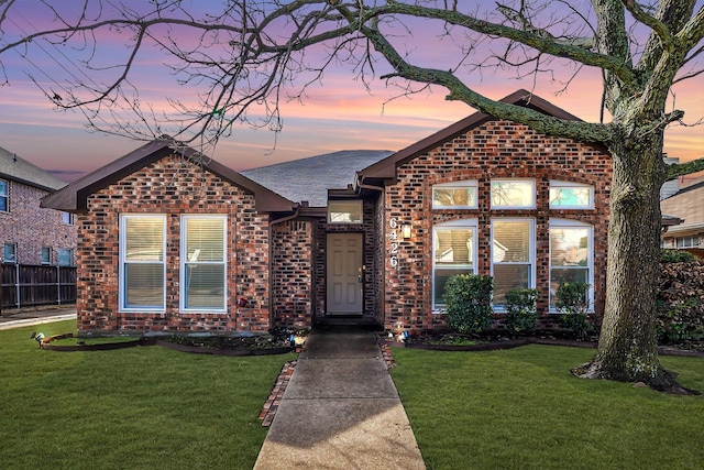 view of front of home with a lawn