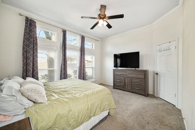 bedroom featuring ornamental molding, light carpet, and ceiling fan