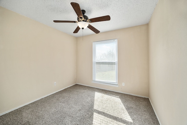 unfurnished room with ceiling fan, carpet floors, and a textured ceiling