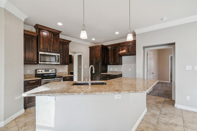 kitchen with dark brown cabinetry, sink, an island with sink, and appliances with stainless steel finishes