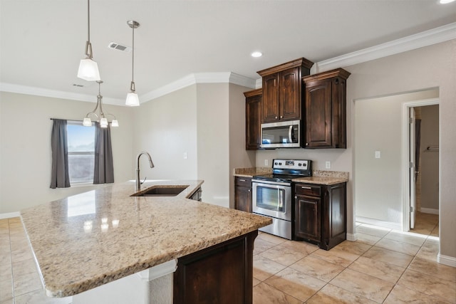 kitchen featuring stainless steel appliances, sink, a center island with sink, and dark brown cabinetry