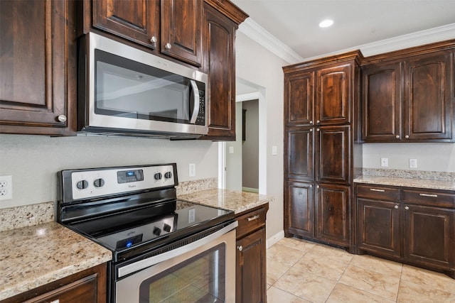 kitchen featuring light tile patterned flooring, light stone counters, dark brown cabinets, ornamental molding, and appliances with stainless steel finishes