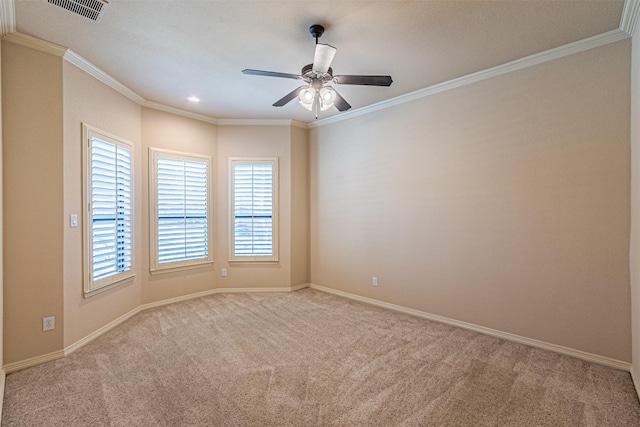 carpeted spare room with ornamental molding and ceiling fan