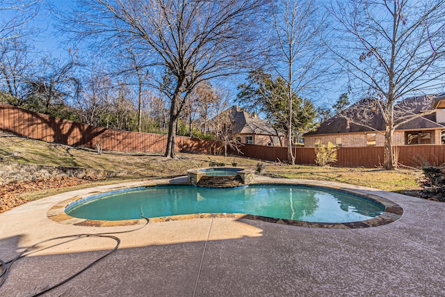 view of pool featuring a patio and an in ground hot tub