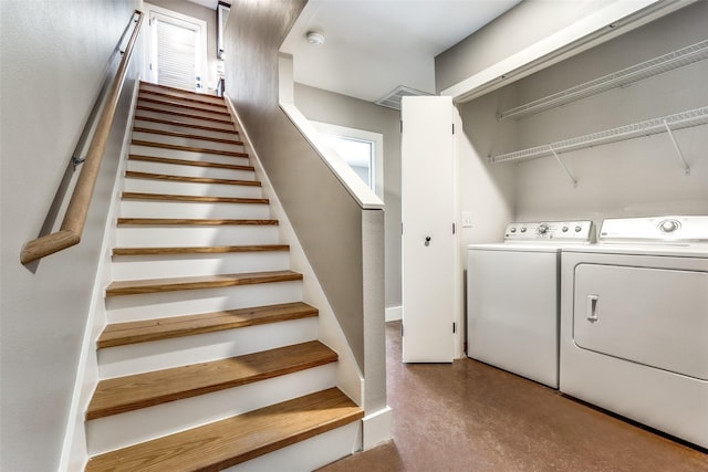 laundry room featuring washing machine and clothes dryer