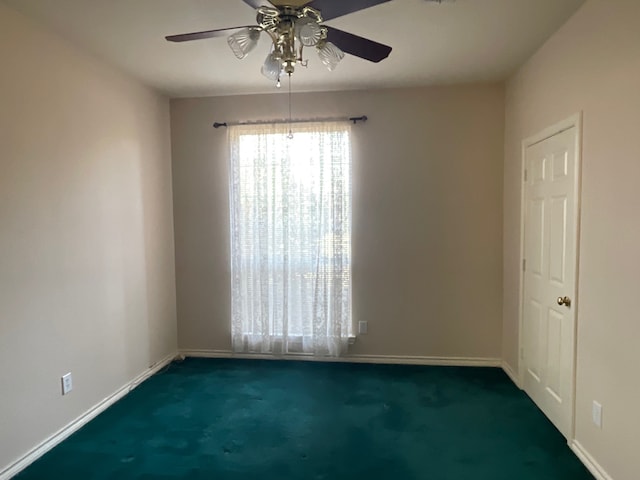 carpeted empty room with ceiling fan