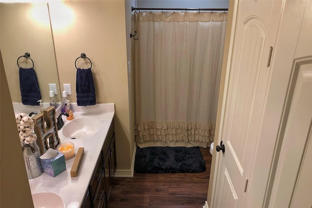 bathroom with vanity, a shower with shower curtain, and wood-type flooring