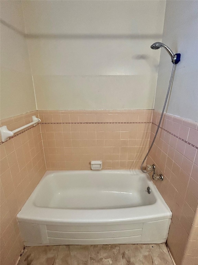 bathroom featuring tile walls and tile patterned flooring