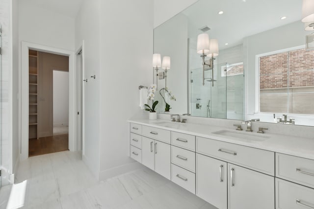 bathroom with vanity and walk in shower