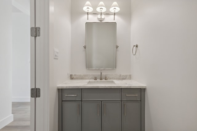 bathroom featuring hardwood / wood-style flooring and vanity